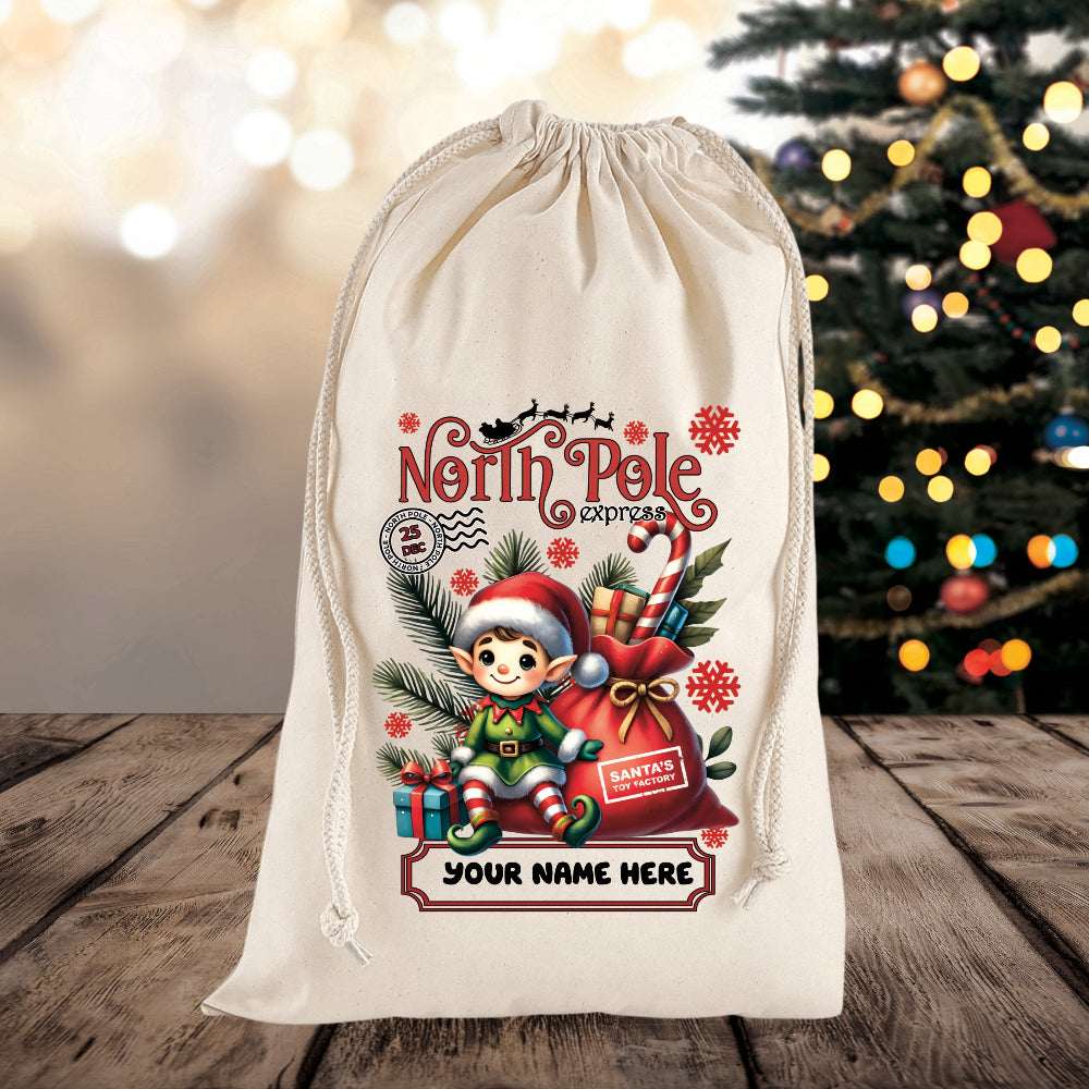 Personalized Christmas gift bag with elf design and 'North Pole Express' text on a wooden surface with a blurred Christmas tree in the background.
