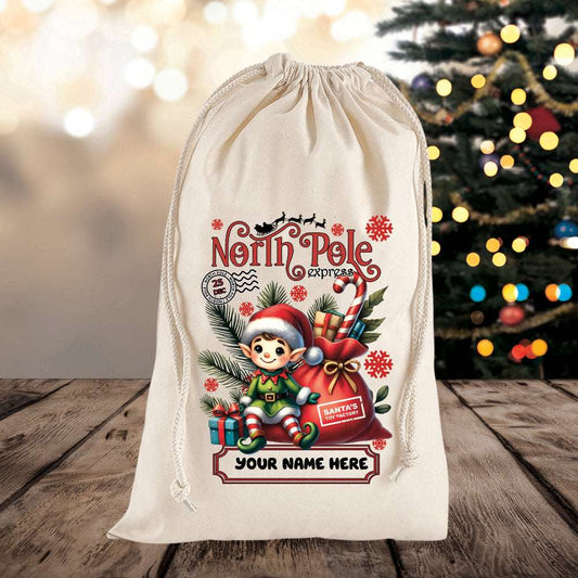 Personalized Christmas gift bag with elf design and 'North Pole Express' text on a wooden surface with a blurred Christmas tree in the background.